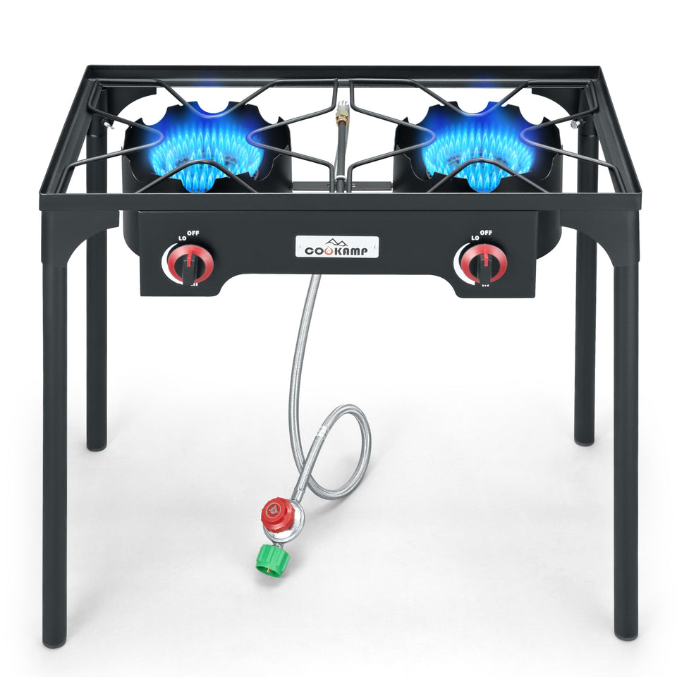 COOKAMP high-pressure double-burner stove front view showing portable outdoor setup.