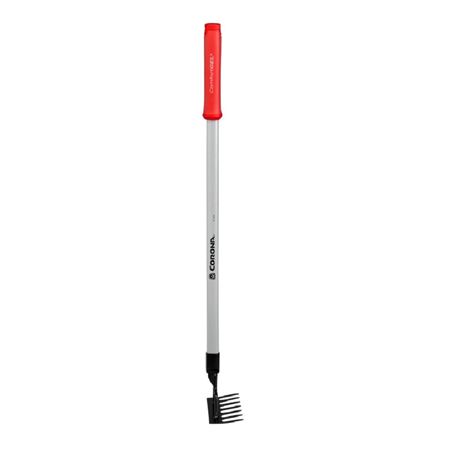 Corona GT 3234 extended reach rake clears leaves around beds with precision.