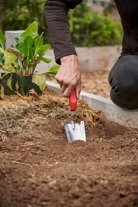 Corona Tools trowel 13-and-a-half-inch reach over beds for extended leverage.