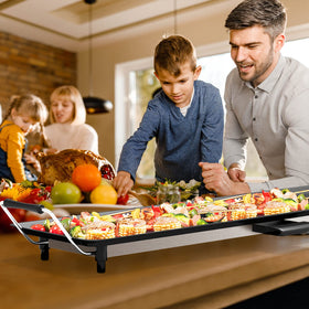 Costzon teppanyaki grill in use for vegetables and meats at a BBQ