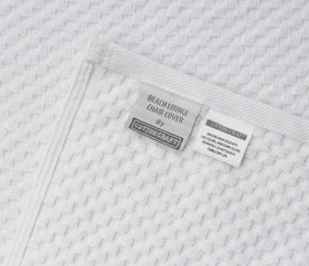 Cotton Craft white lounge chair cover adds fresh poolside aesthetic.