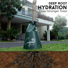 Courtyard Dew tree watering bag filled and secured on trunk with hose connection for easy refills.