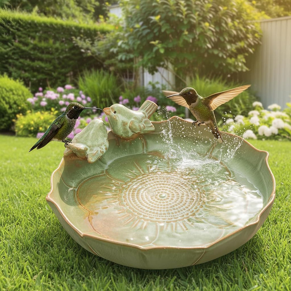CPWWSXPG ceramic bird bath on the ground blends with greenery to attract backyard birds.