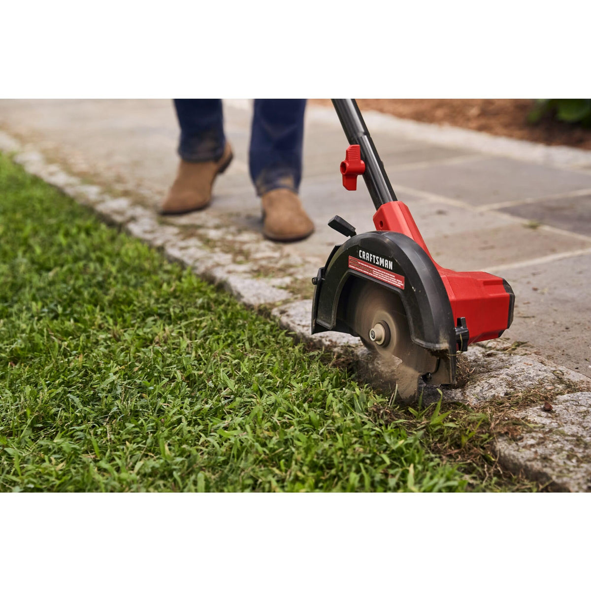 CRAFTSMAN 20V Edger in-use along sidewalk demonstrates precise edging.