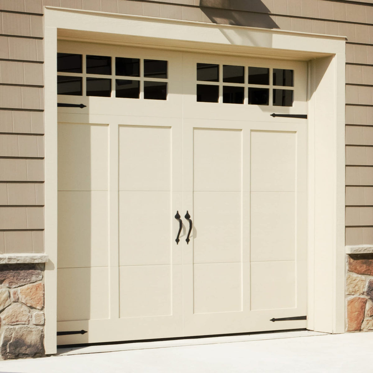 Cre8tive Hardware Classic Spade magnetic handle installed on a garage door