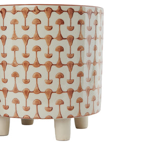 Creative Co-Op footed stoneware planter highlights geometric abstract motif on base
