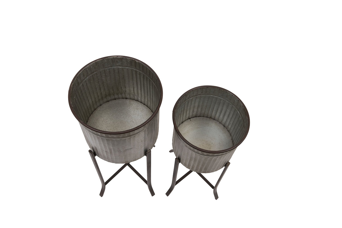 Creative Co-Op planters designed for indoor or covered outdoor use with sturdy stands.