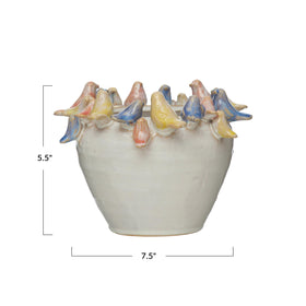 Creative Co-Op planter with reactive multicolor glaze enhances cottage-style decor.