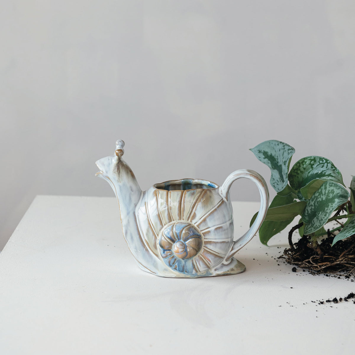 Creative Co-Op 8.75 inch stoneware watering can, durable and easy to maneuver.