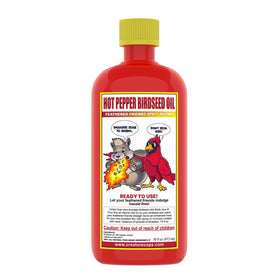 CreatureCops Spicy Squirrel Seed Sauce bottle close-up highlighting natural ingredients