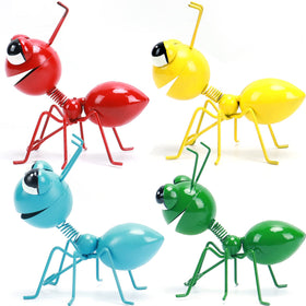 Cruis Cuka green ant yard art figurine adds playful curb appeal on a fence