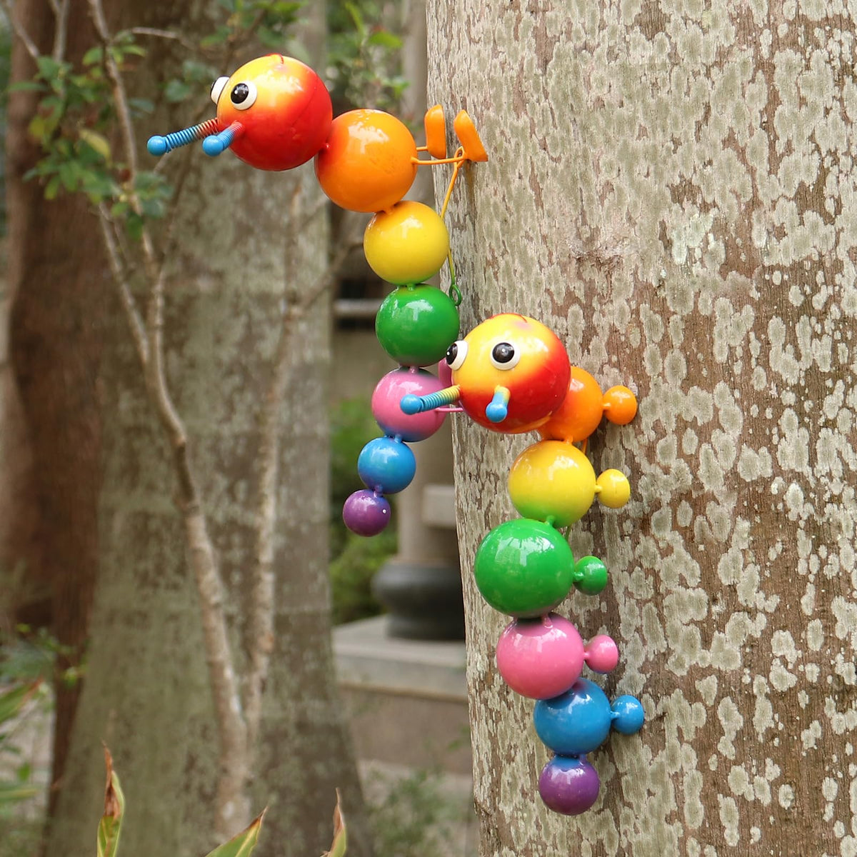 Cruis Cuka caterpillar statue 2-pack wall-hanging ready to brighten fences and walls.