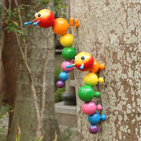 Cruis Cuka caterpillar statue 2-pack wall-hanging ready to brighten fences and walls.