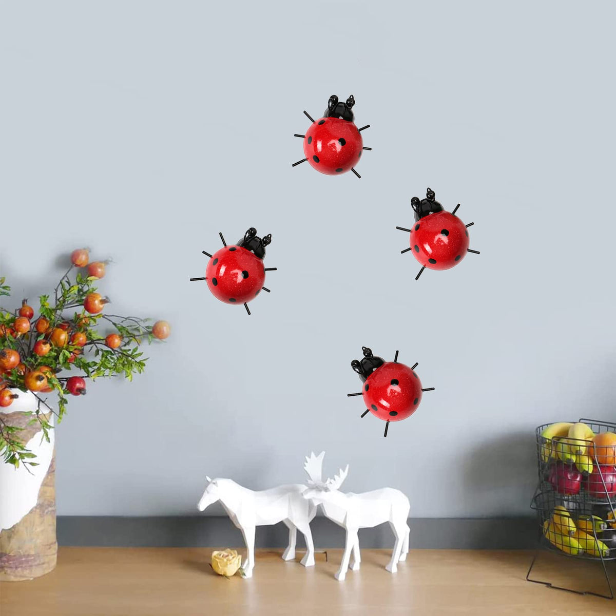 Cruis Cuka hand-painted ladybugs wall art stays bright through weather exposure.
