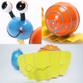 Cruis Cuka red snail ornament brings vibrant color to the yard