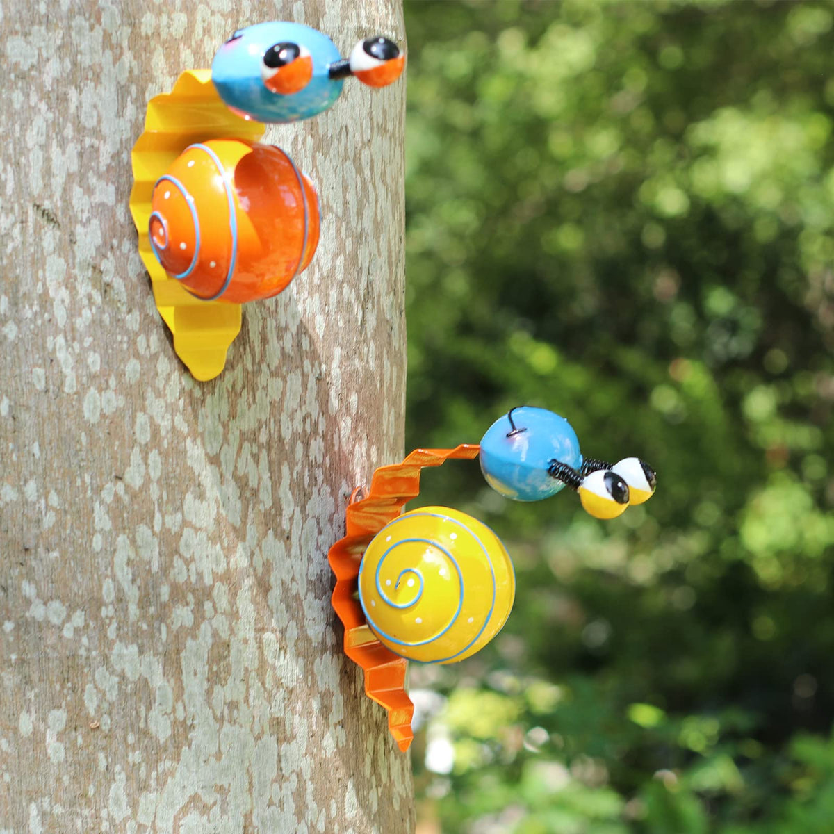 Cruis Cuka snail fence ornament brightens borders.