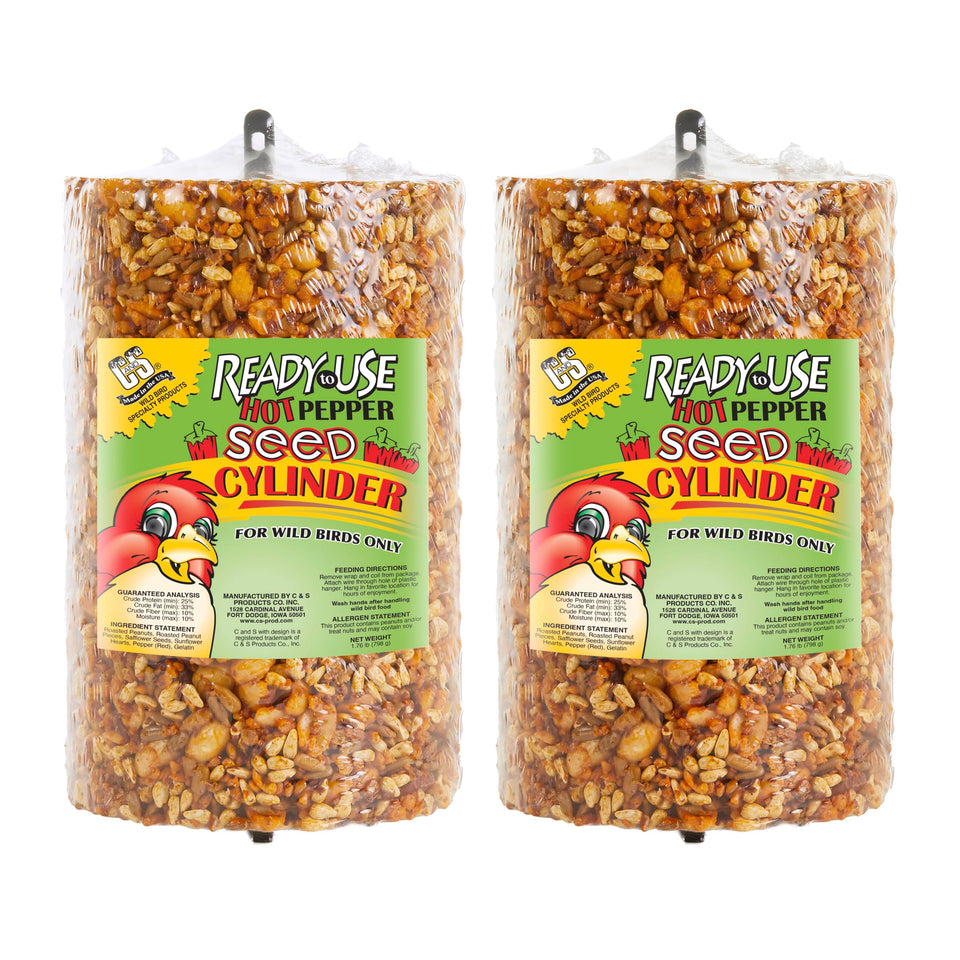 C&S Ready to Use Hot Pepper Seed Cylinder hanging from a feeder, attracting birds safely.