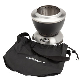 Patio dining scene with Cuisinart Cleanburn on a table at night