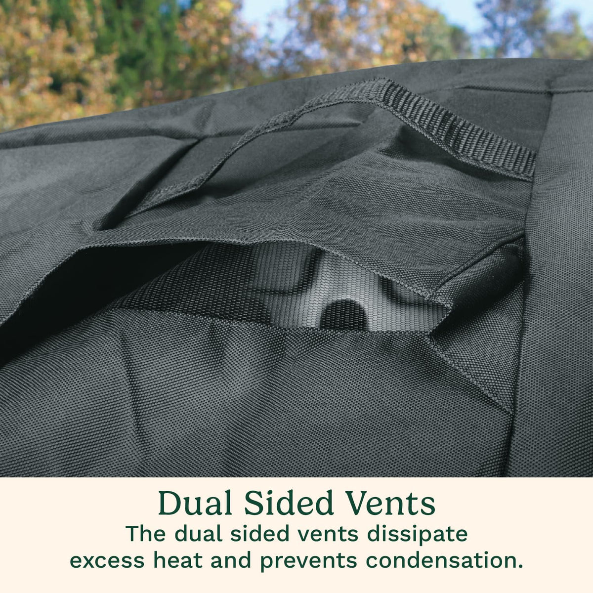 Cuisinart grill cover secured with straps to stay put in windy conditions.