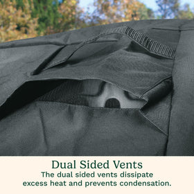 Cuisinart grill cover secured with straps to stay put in windy conditions.