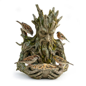 Cuoct Quiet Offering tree-feeder featuring ancient tree-spirit sculpture for close birdwatching.