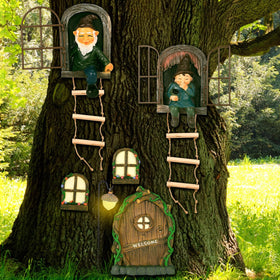 Czlotyh tree hugger gnome on a branch adds cheerful garden charm