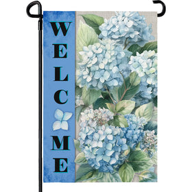 Dacawin Hydrangea flag front view on porch, welcoming spring with blue blooms.