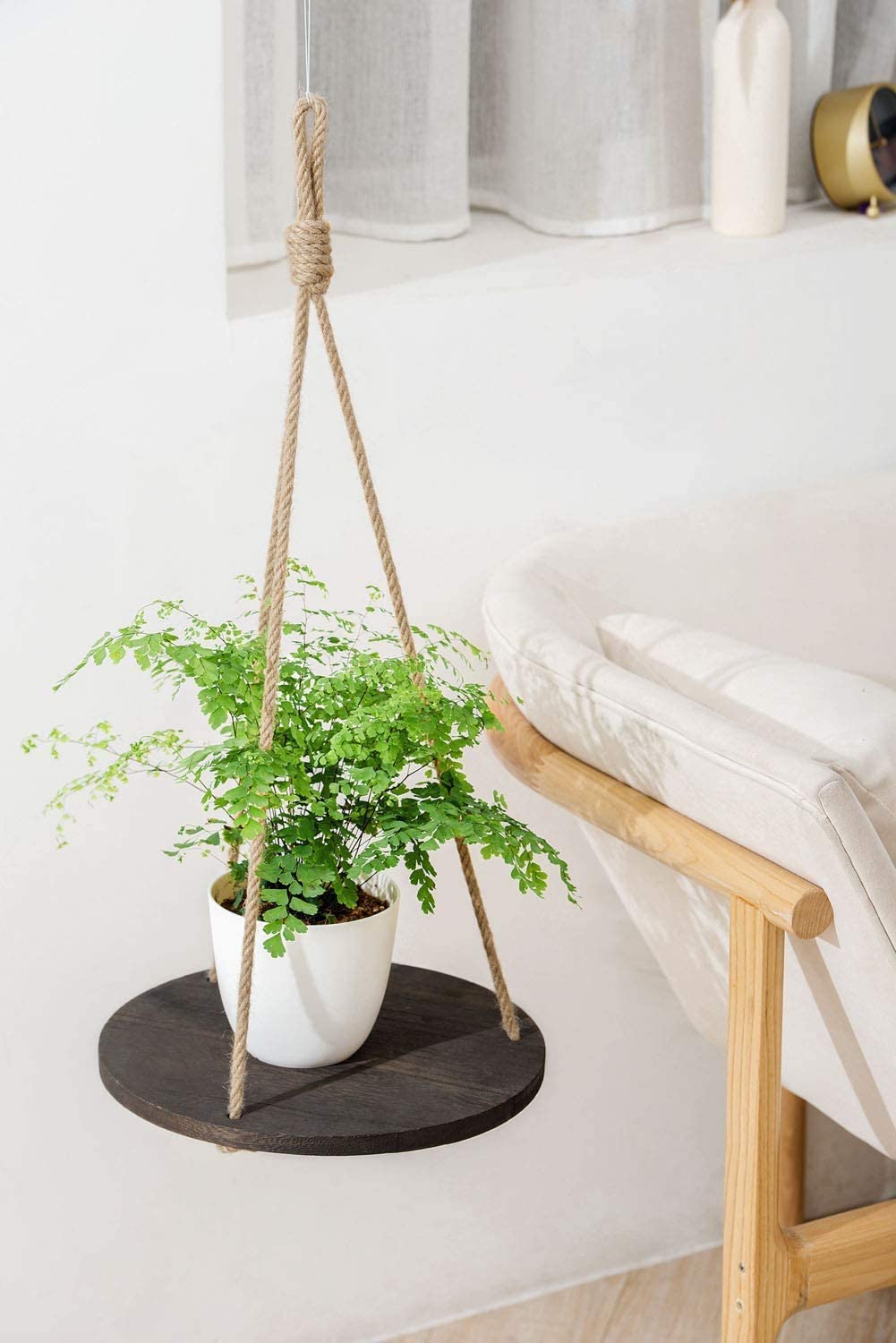 Dahey macrame rope display shelf offers versatile mounting from ceiling or wall.