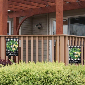Damukoo flag stand by front door with seasonal flag ready.
