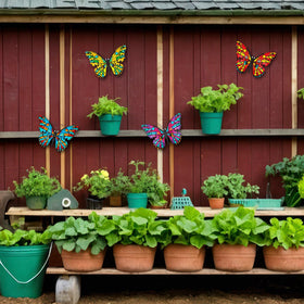 Daogtc butterfly wall decor 4-pack in garden setting, bright accents to charm any yard