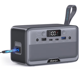 DaranEner portable power station held in hand showing compact travel-friendly design.