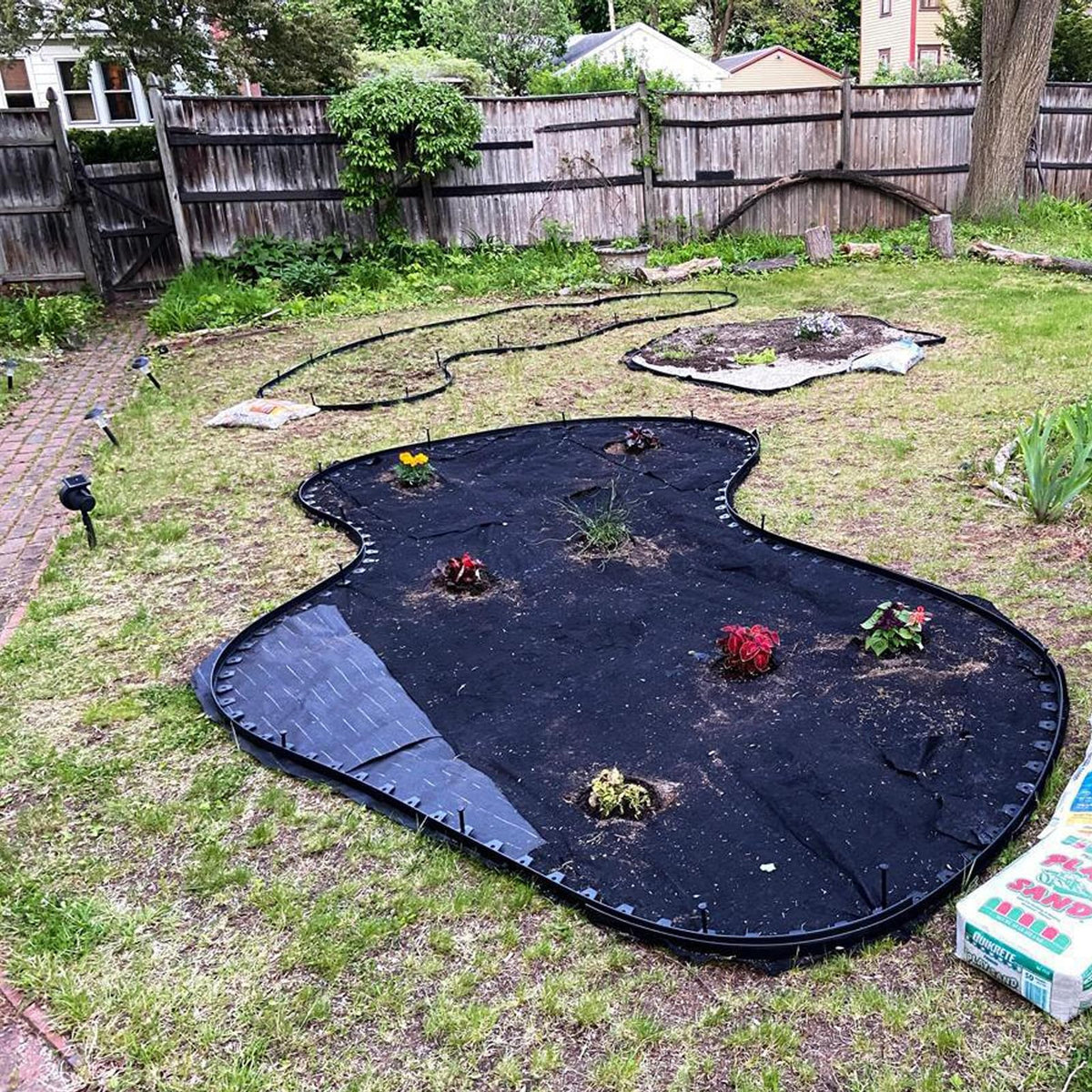 DIY garden project with DasTior edging creating clean, professional-looking borders.