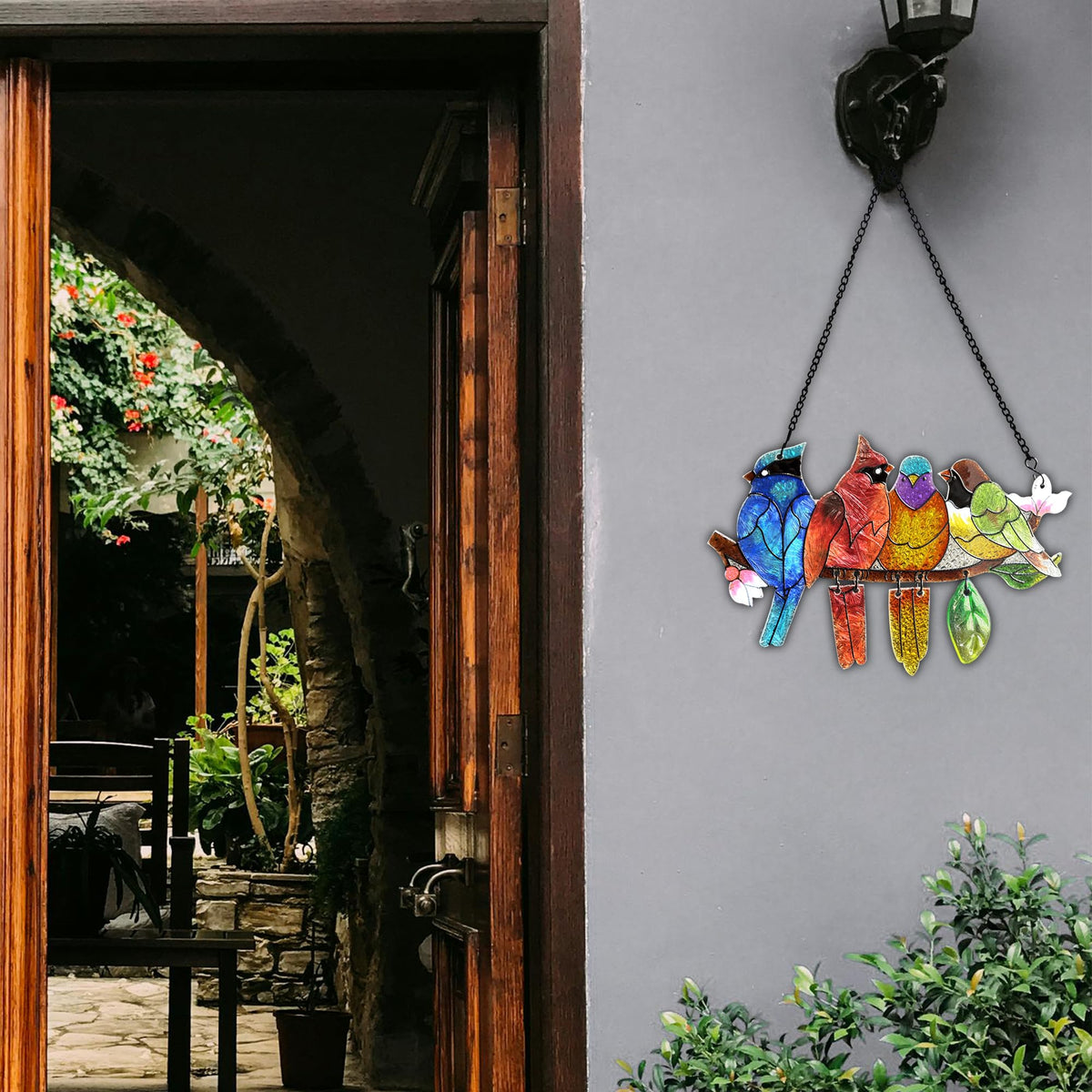 DASTOLL glass art bird on branch enhances natural light in any room.