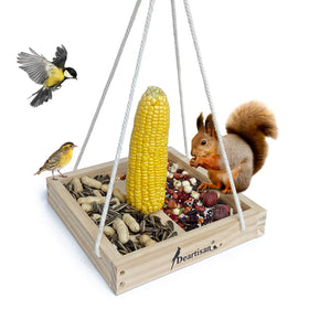 Deartisan platform feeder with cedar tray hanging, attracting wild birds.