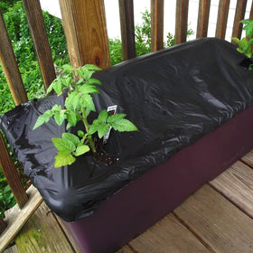 DECOHS sleek black mulch cover enhances neat garden aesthetics