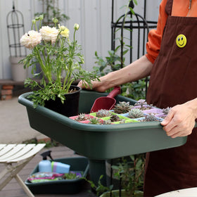 Defemim Garden Tidy Tray catching spills during watering and potting