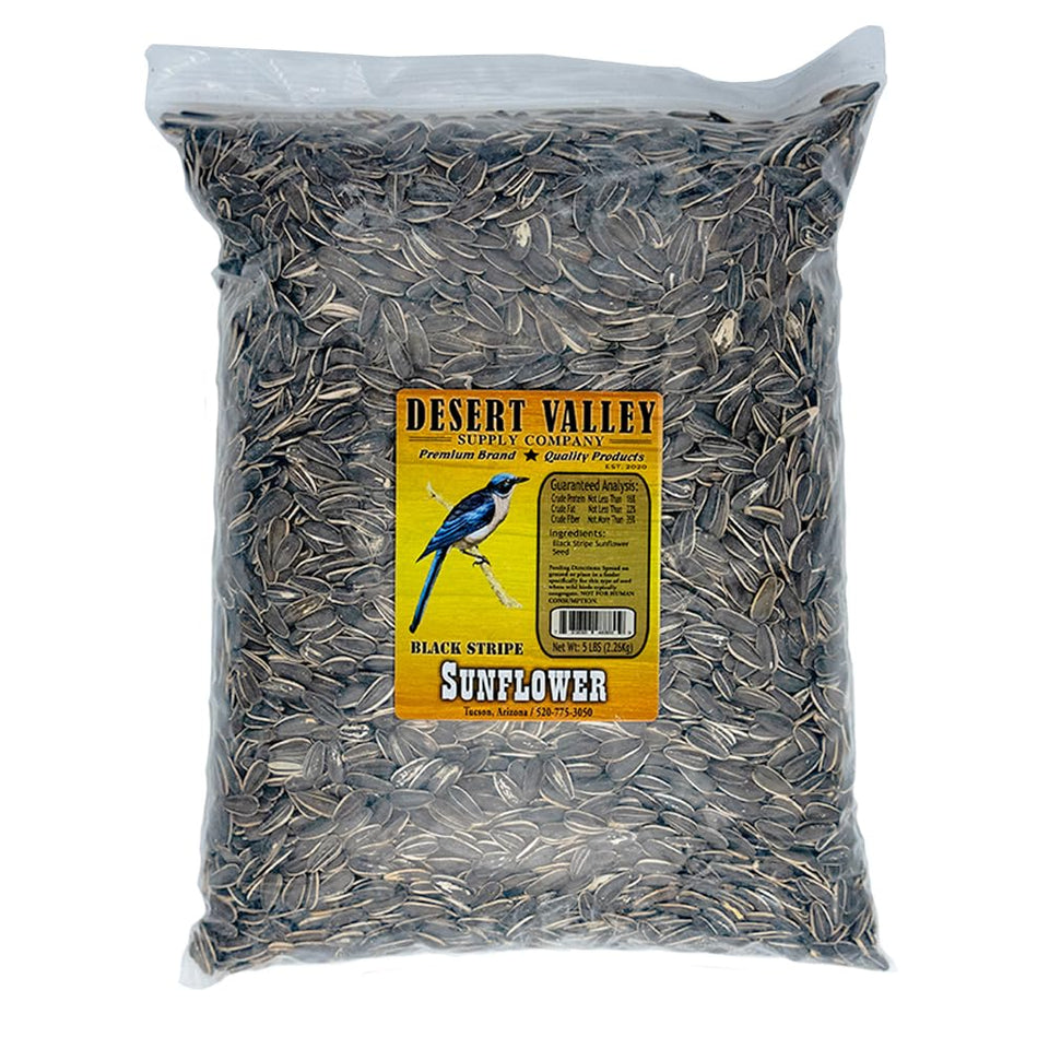 Desert Valley Supply striped sunflower seed bag at a feeder attracting colorful birds.