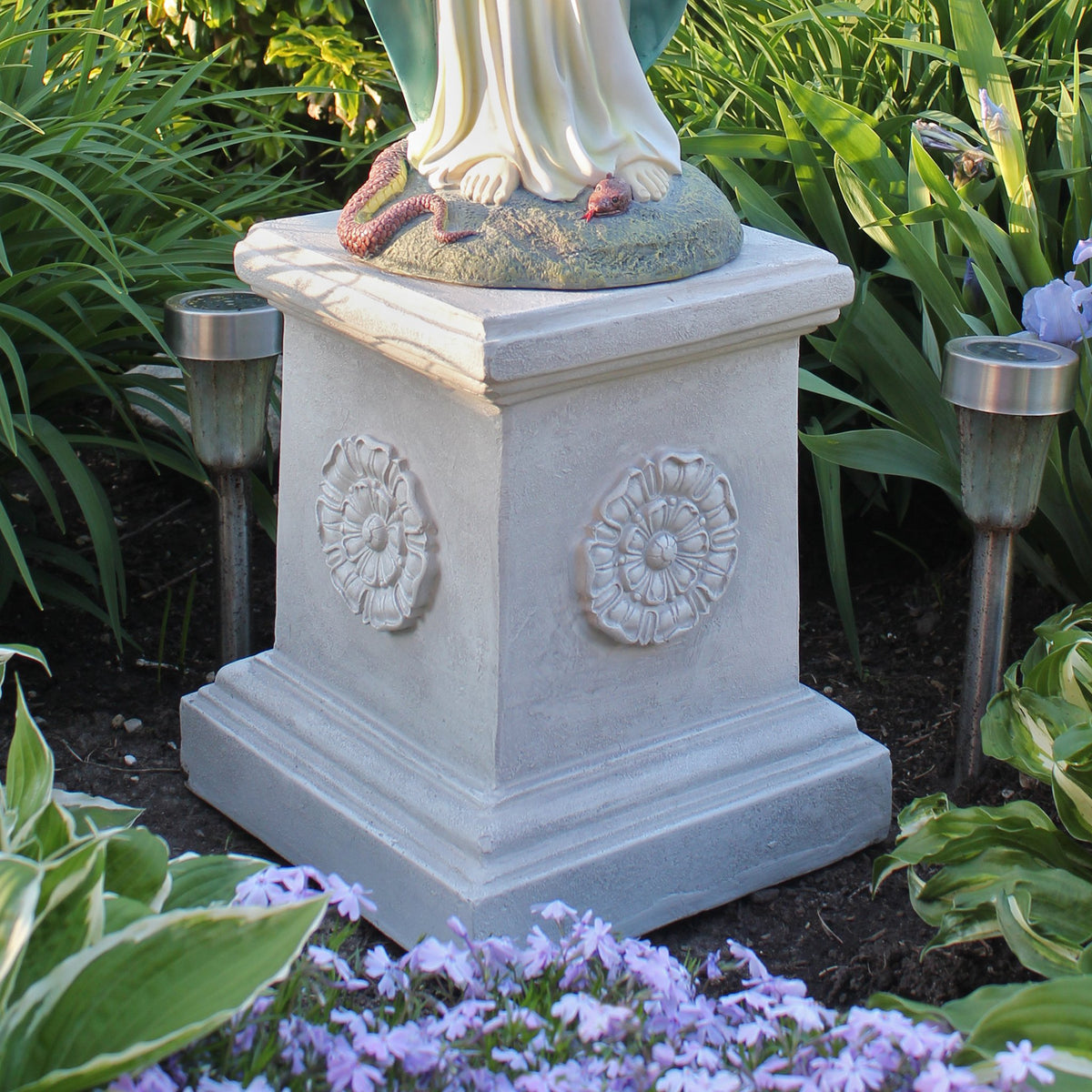 Design Toscano plant stand rosette base adds timeless plant display support.