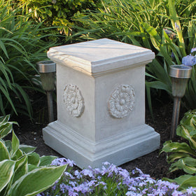 Design Toscano rosette pedestal showcases garden sculpture with antique stone finish.