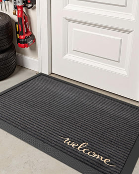 DEXI grey welcome mat adding subtle style to any entry