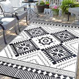 DiiKoo waterproof outdoor rug in black and white with reversible boho patterns for patio.