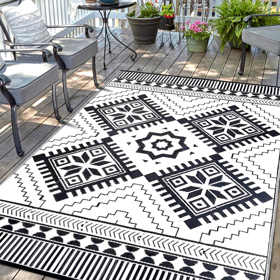 DiiKoo waterproof outdoor rug in black and white with reversible boho patterns for patio.