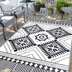 DiiKoo waterproof outdoor rug with reversible boho pattern for patio or beach setups.