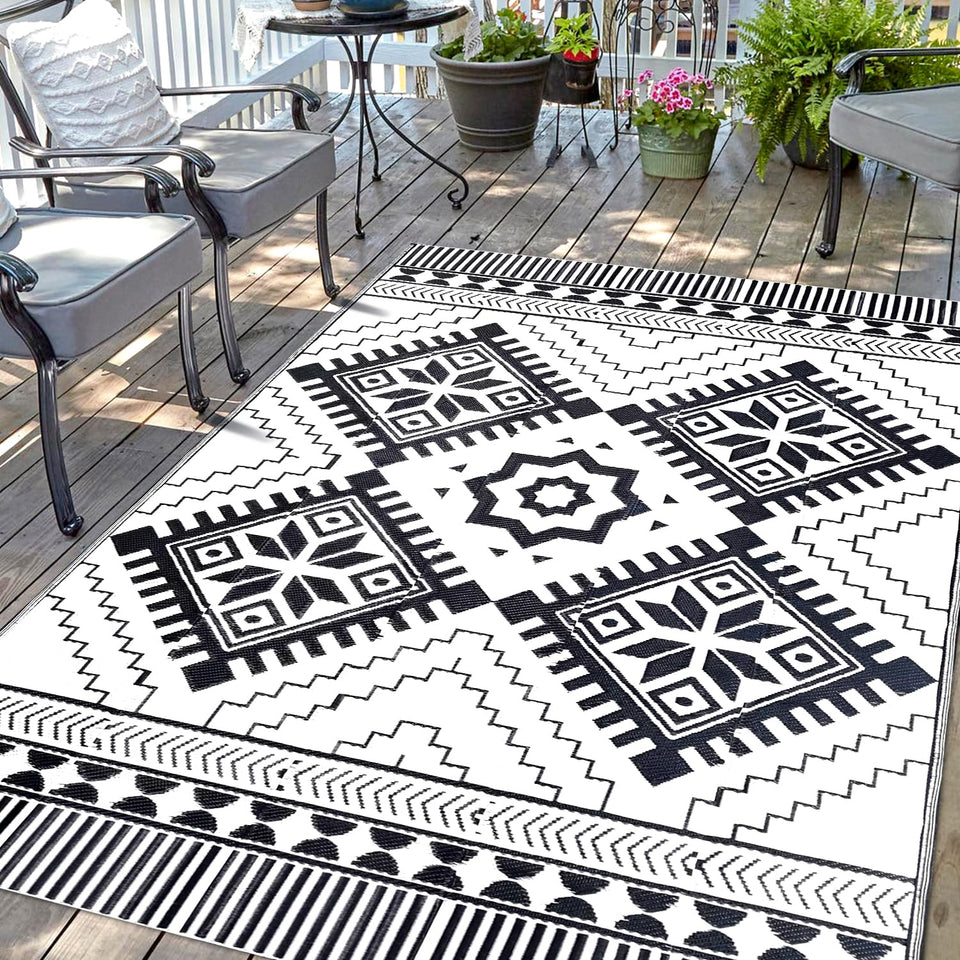 DiiKoo waterproof outdoor rug with reversible boho pattern for patio or beach setups.