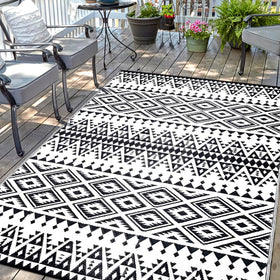 DiiKoo waterproof outdoor rug with Bohemia reversible pattern for patios and decks.