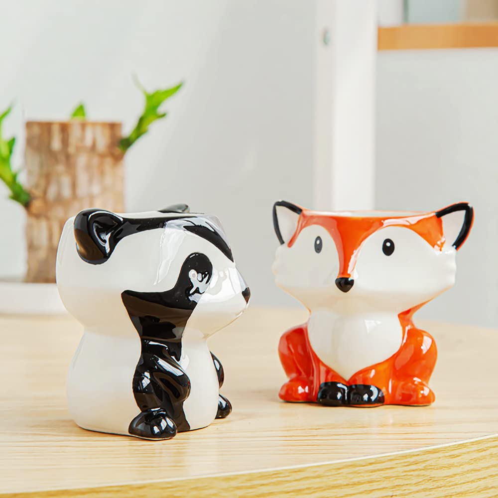 DIYOMR cow planter on a balcony table adds color and life outdoors.