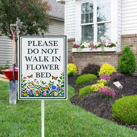 Dlonvoh pollinator habitat sign with stake helps protect beds.