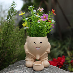 Dolkgy cute head planter with a playful face ideal for indoor decor.