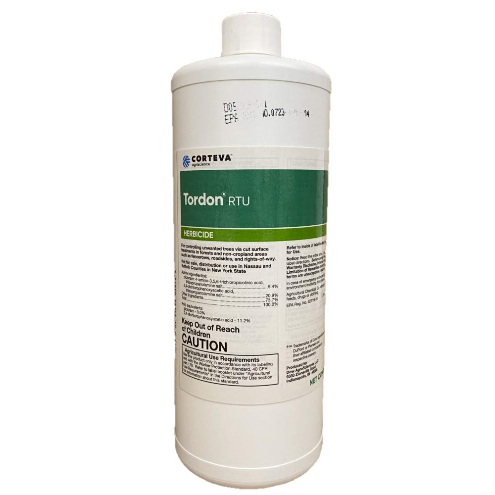 Dow AgroSciences Tordon RTU squirt bottle applying treatment to tree stump to prevent resprouts