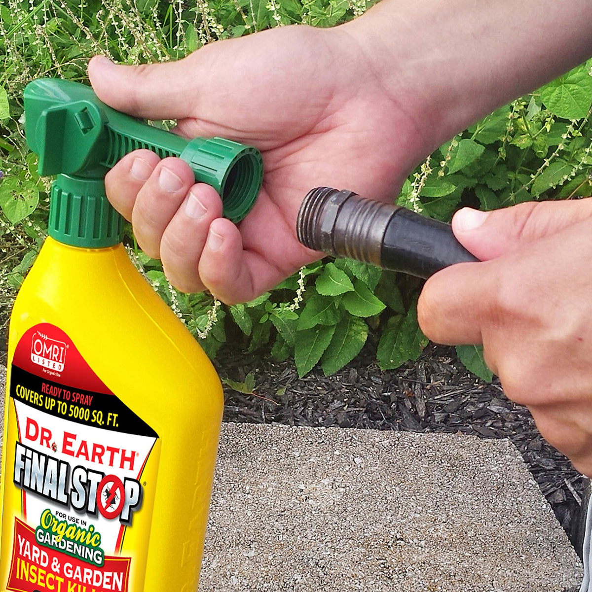 Dr. Earth Final Stop in action delivering yard and garden pest control.